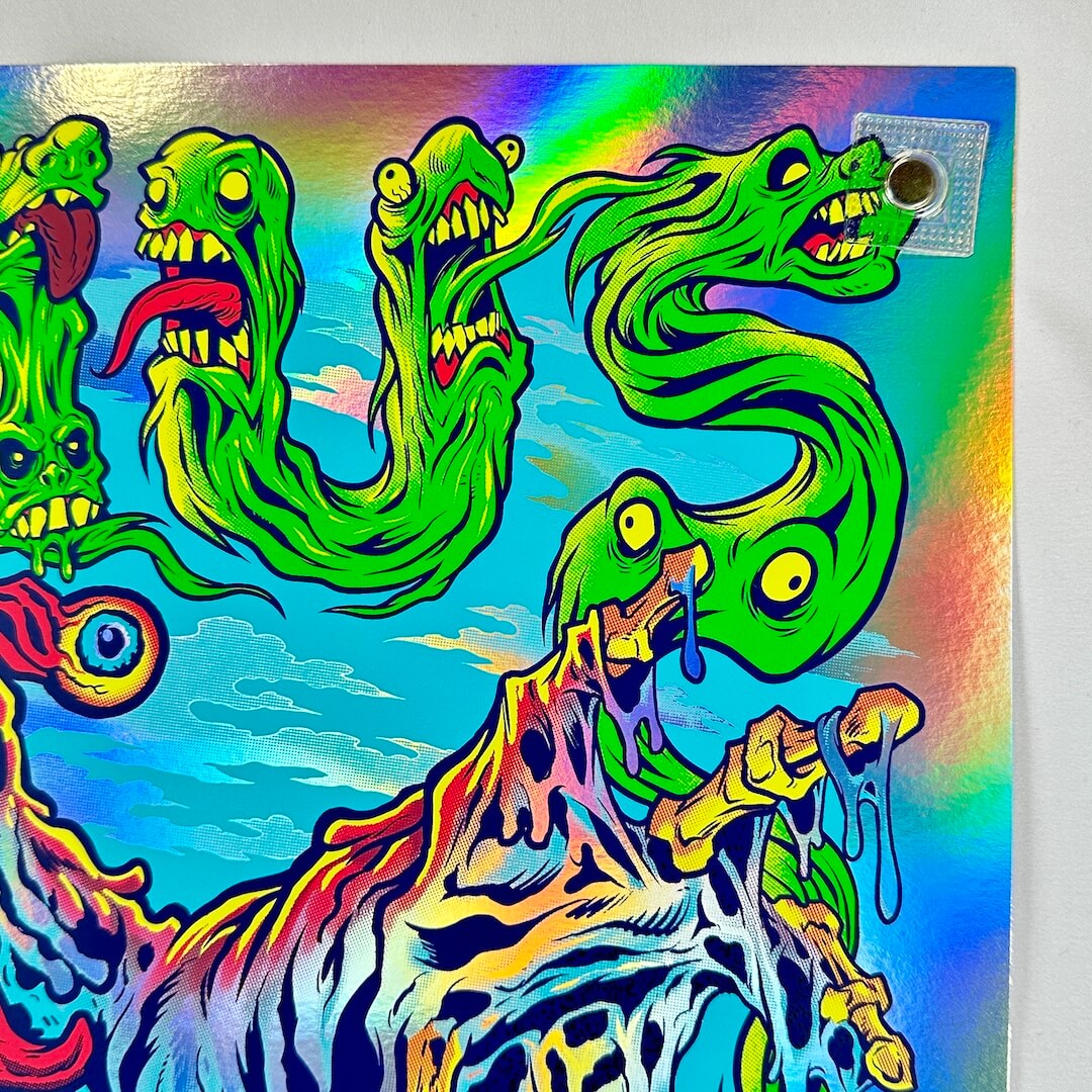 Top right corner of poster showing no damage to edges or corner, highlighting rainbow foil aspect of poster.