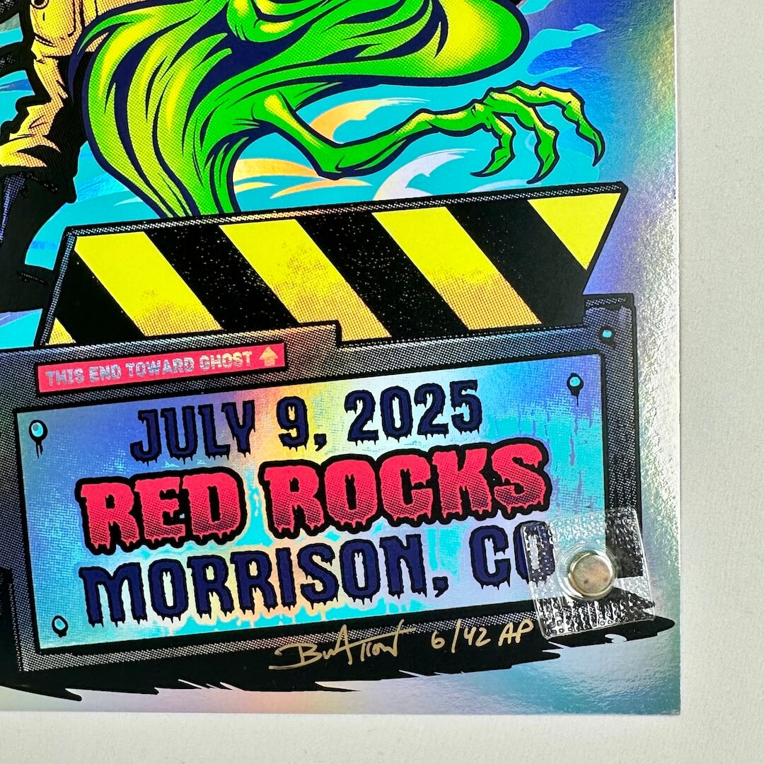 Colorful concert poster with a clapperboard design, featuring 'Red Rocks Morrison, CO' and a date. Below is artist signature in gold marker.
