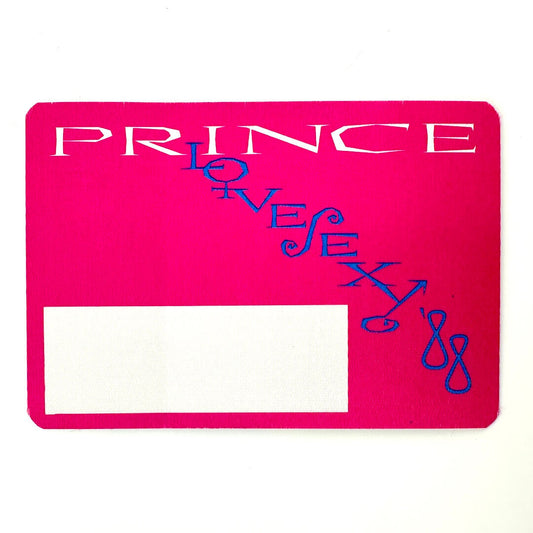 Pink fabric backstage pass for Prince against white background.
