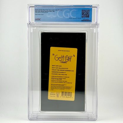 Image of sealed VHS tape in clear plastic case with grading info at top. VHS is black with yellow label with purple print.