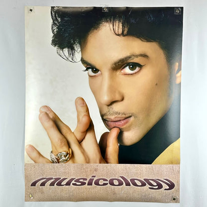 Poster of portrait of Prince with "Musicology" on banner along bottom. 