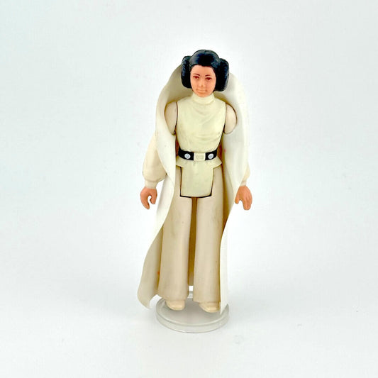 Princess Leia action figure in white outfit against white background.