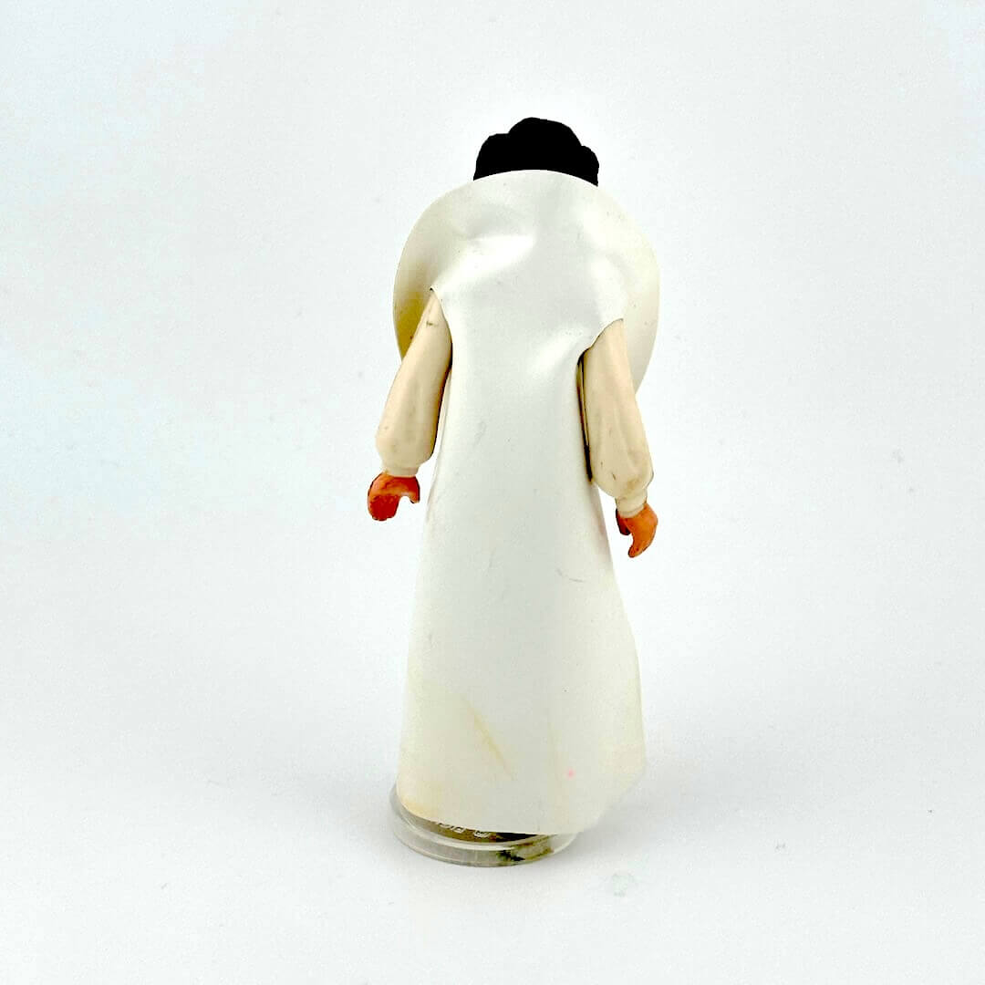 Princess Leia action figure in white outfit against white background.