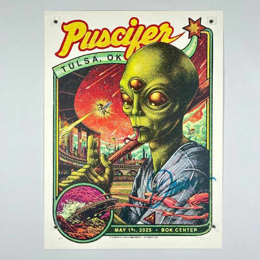 Alien holding a baseball bat with 'Puscifer' and 'Tulsa, OK' text on a colorful background stylized like vintage sports card.