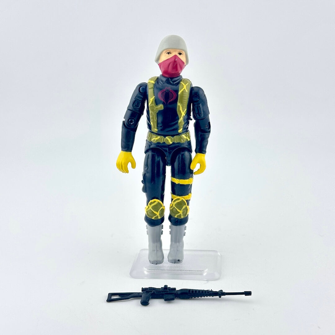Toy figure in a futuristic outfit with a helmet and mask on a white background
