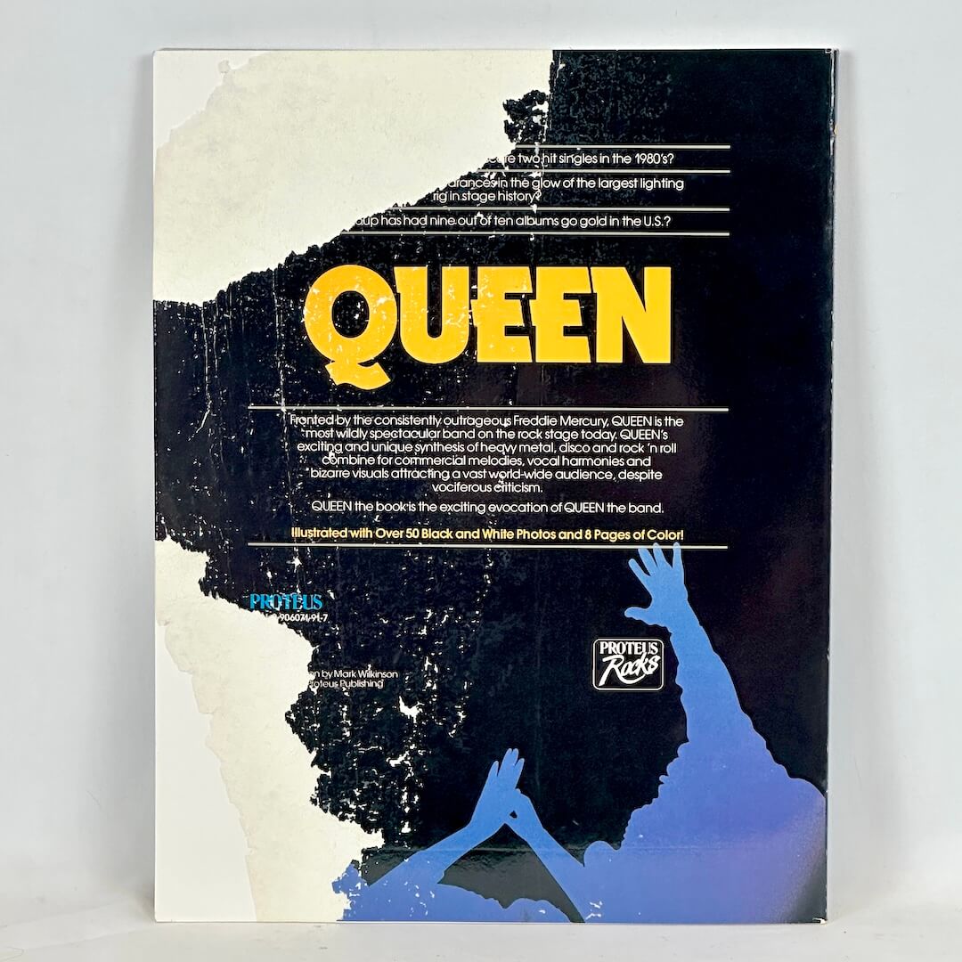 Backside of book with torn back cover. 