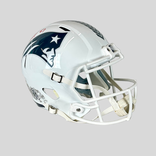 Signed white football helmet with Patriots logo