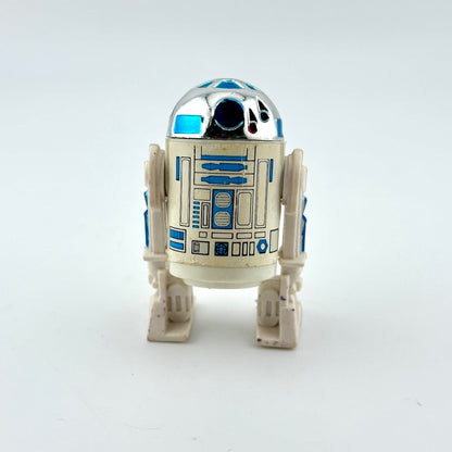 Toy robot resembling R2-D2 from Star Wars on a white background