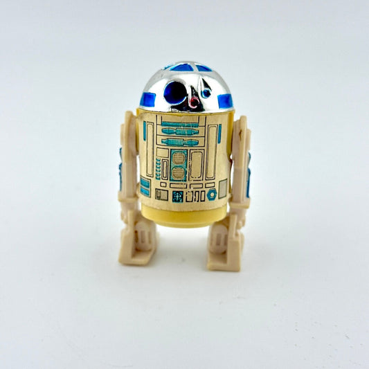 Toy robot resembling R2-D2 from Star Wars on a white background