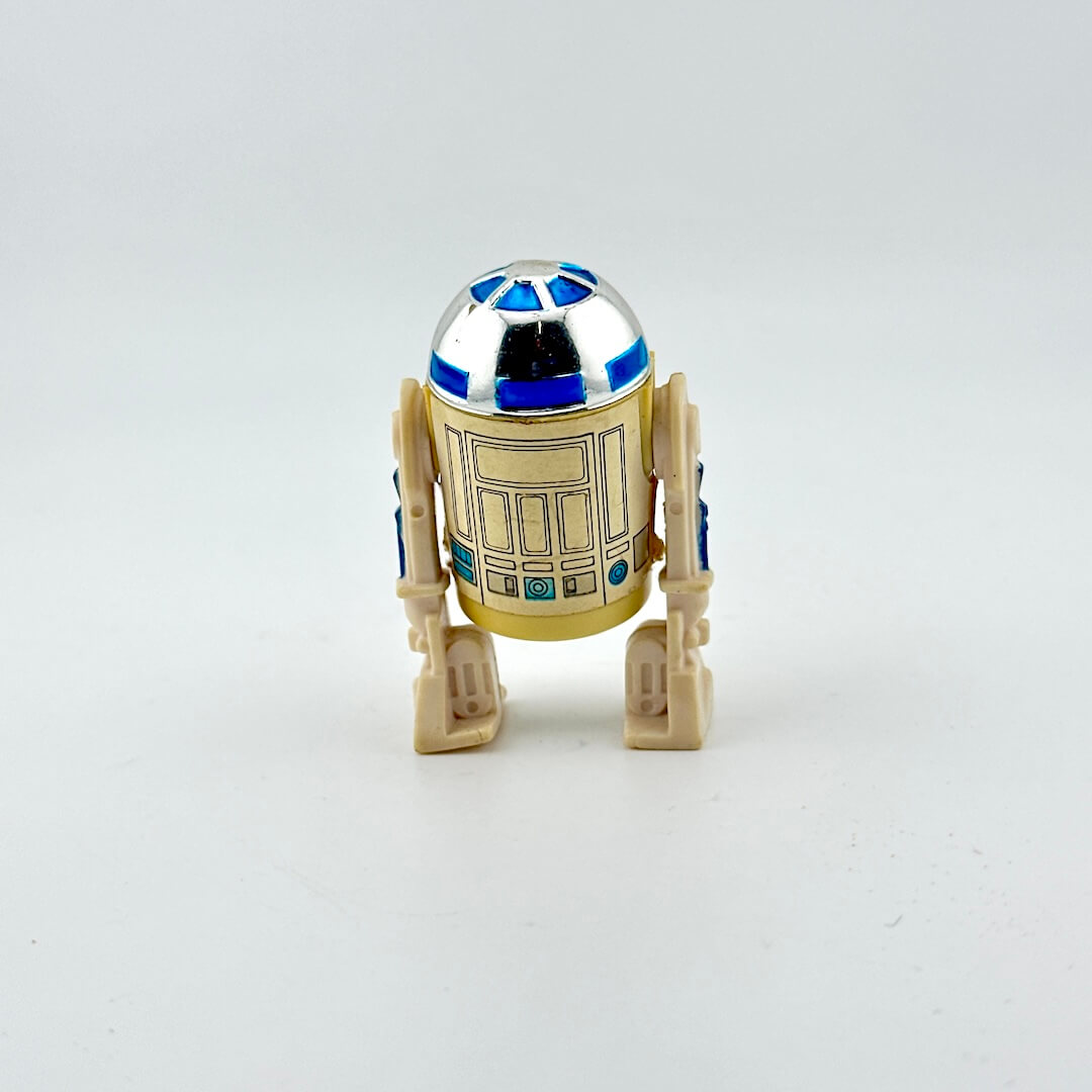 Toy robot resembling R2-D2 from Star Wars on a white background