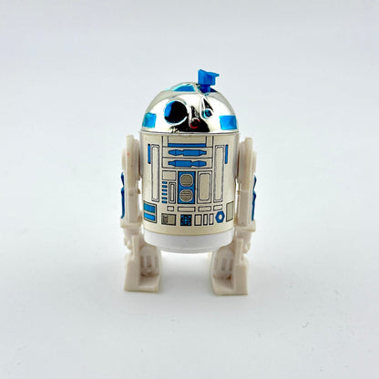 Toy robot resembling R2-D2 from Star Wars on a white background