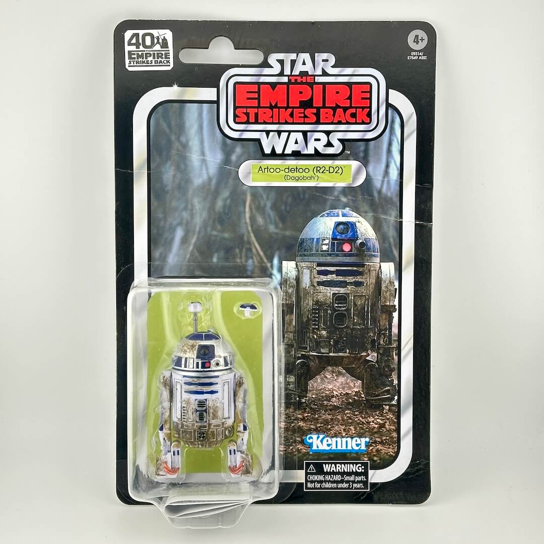 Star Wars action figure of R2-D2 in its original carded packaging with retro-style card back. 