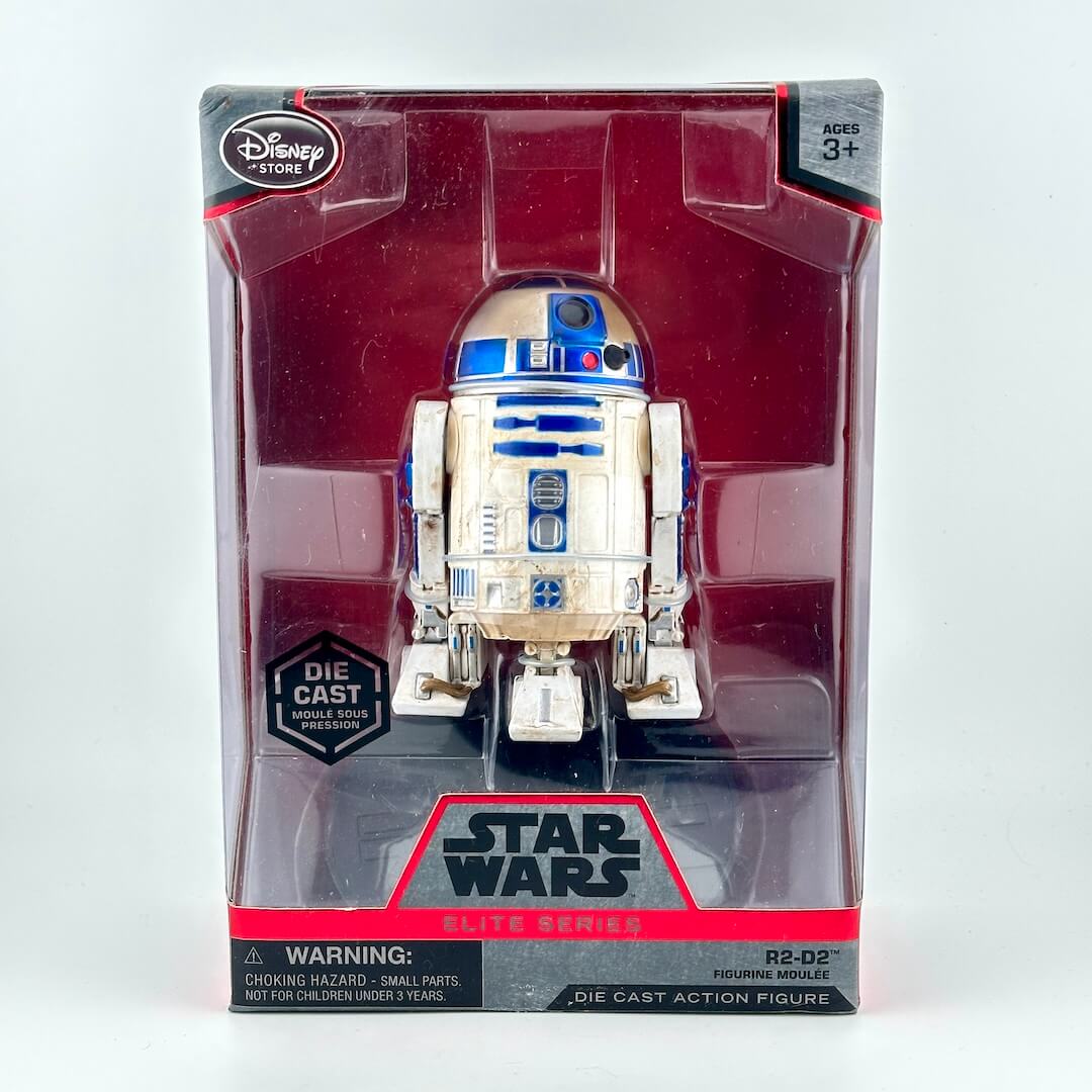 Disney Star Wars R2-O2 die cast action figure in its original window box packaging.
