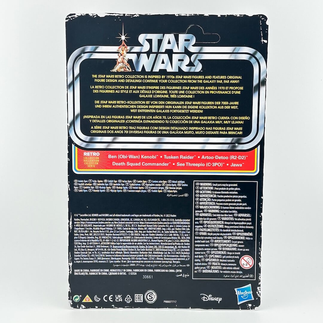 The back of a Star Wars action figure packaging box, featuring the Star Wars logo, product description, and regulatory text.