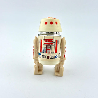 Toy figure of a robot with a white and beige color scheme on a light gray background