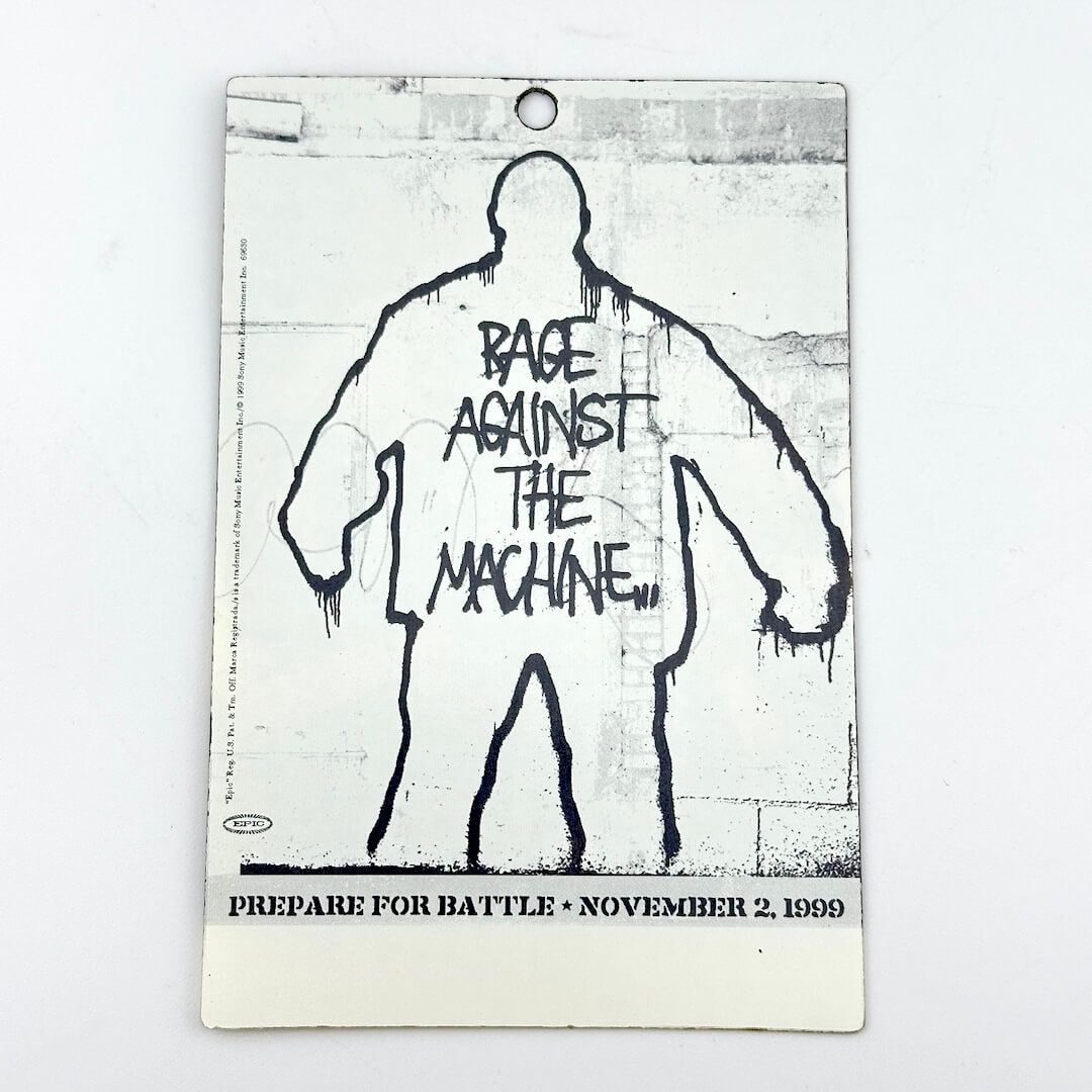 Album cover for 'Rage Against the Machine' with a stylized figure and text on a textured background