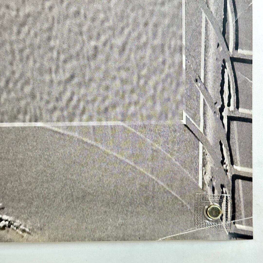 Bottom right corner with crease across it and some other signs of wear.