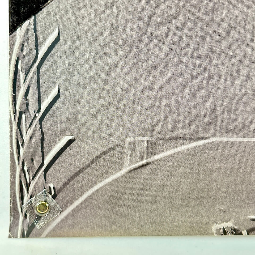 Bottom left corner of poster with some wear along right edge. 