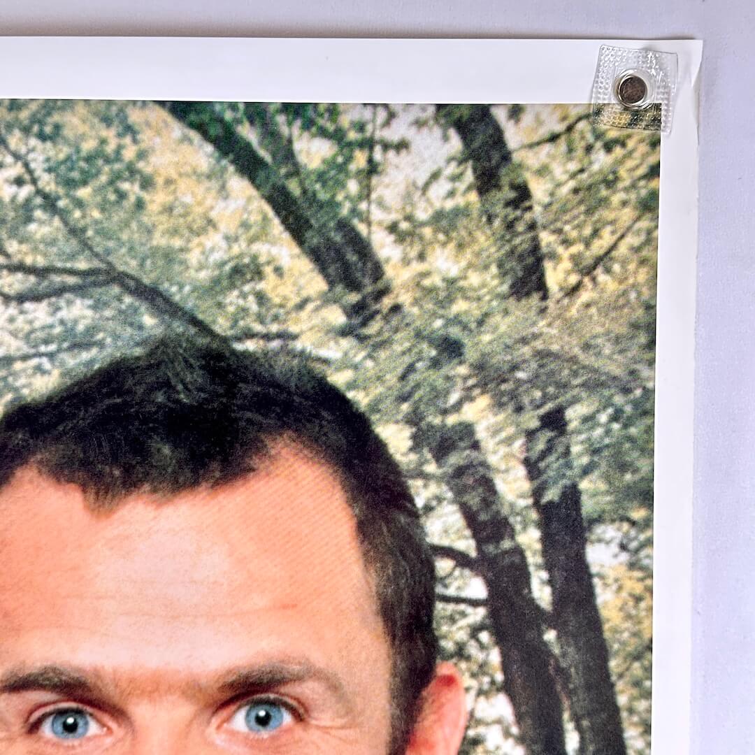 Top right corner of poster with some damage to corner. 