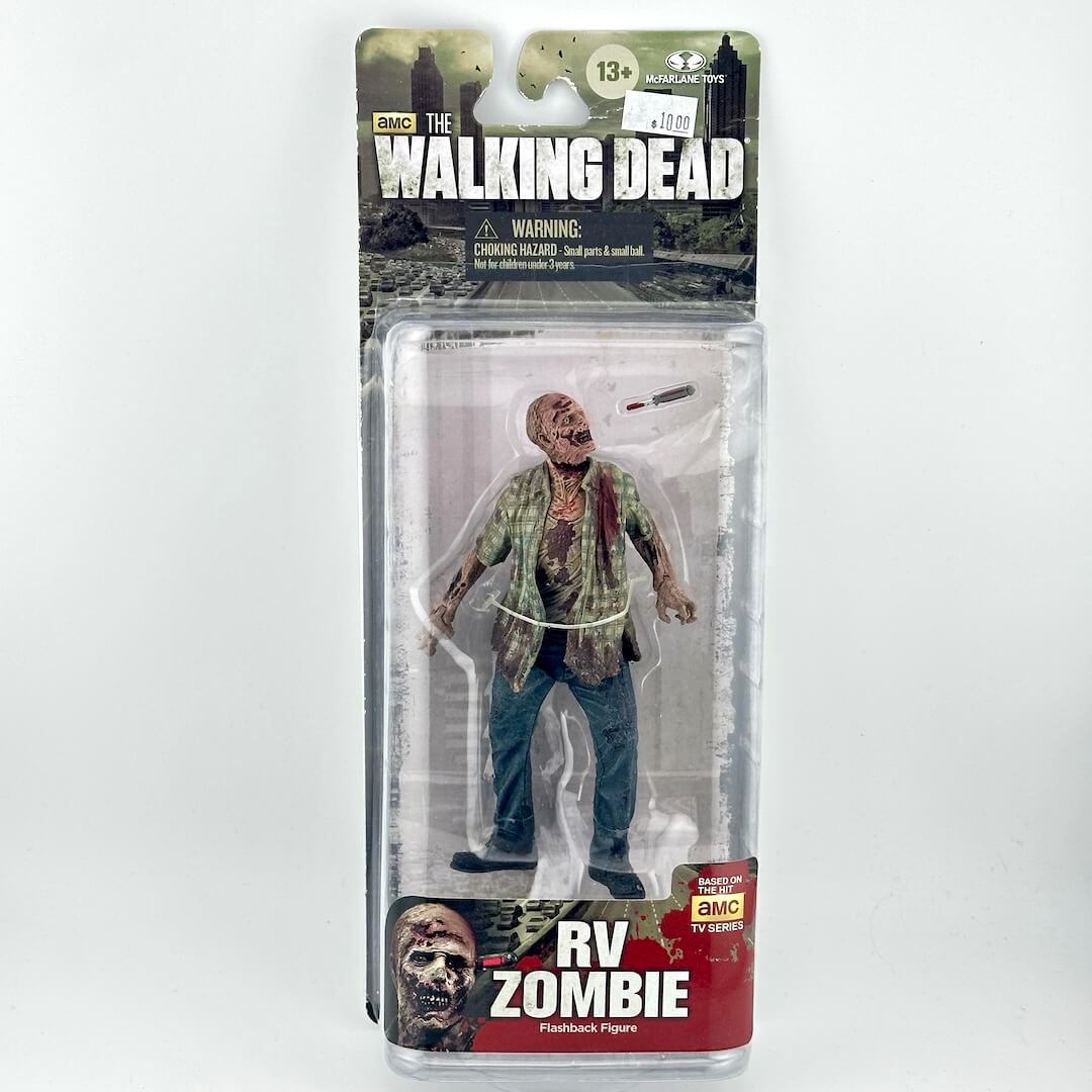 The Walking Dead RV Zombie action figure in its original blister card packaging, featuring a detailed zombie figure.