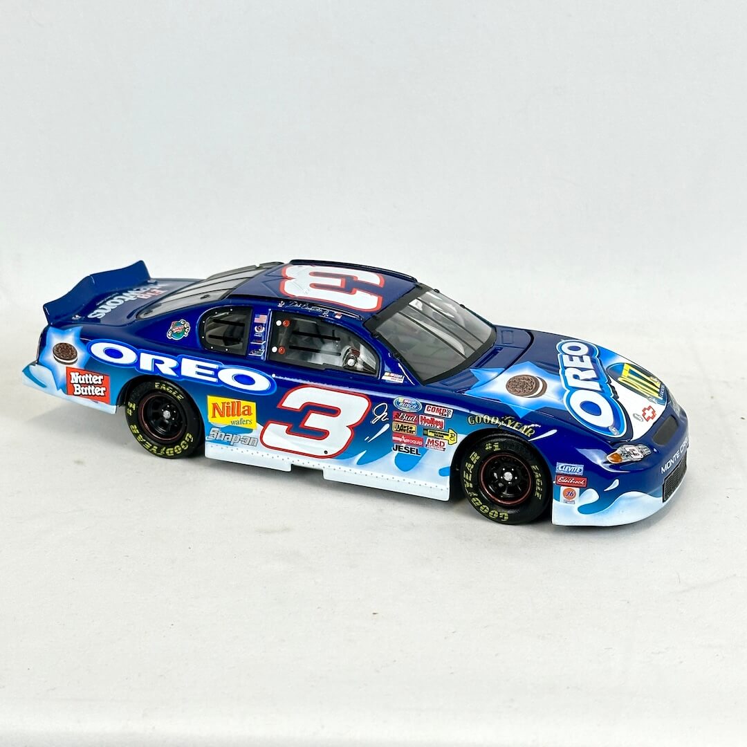 Model race car with Oreo and other brand logos on a white background