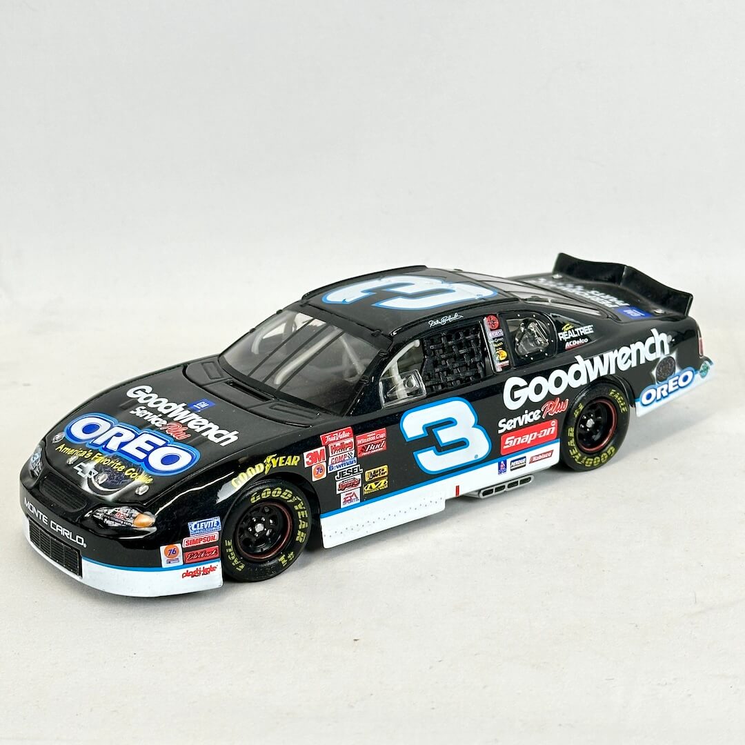 Model car with multiple brand logos on a white background