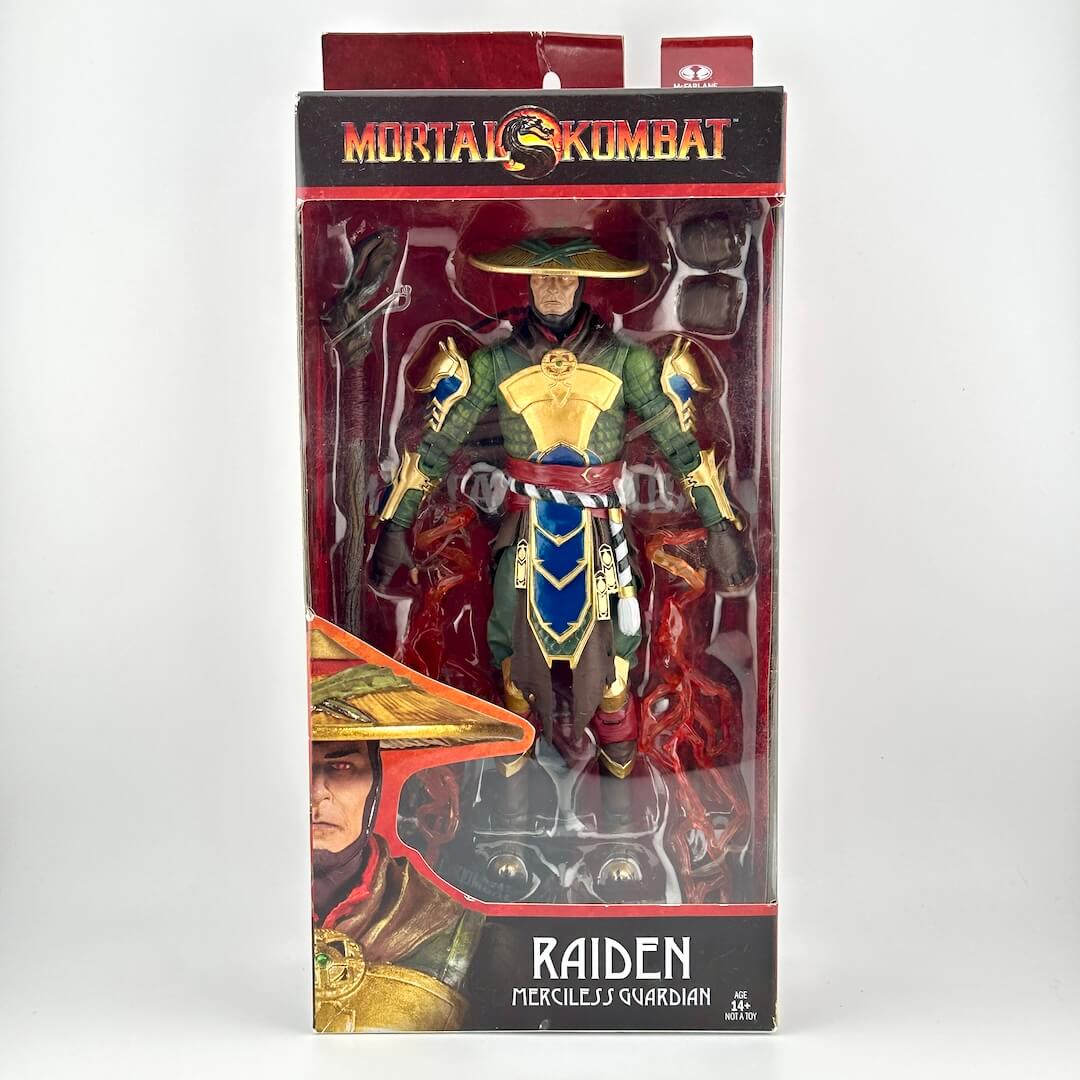 Mortal Kombat action figure in original retail box with accessories and extra hands inside.