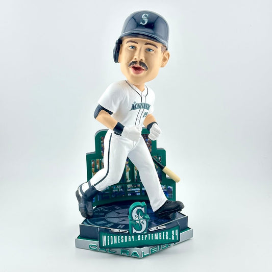 Bobblehead figure of player in white uniform with blue base with Seattle Mariners branding. 