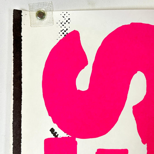 Top left corner of poster with pin holes.