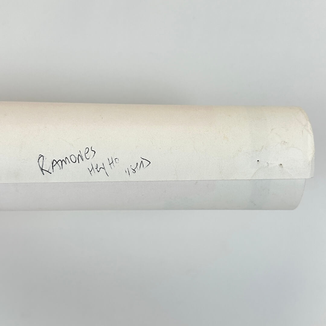 Rolled poster to show artist name in pen on back. 