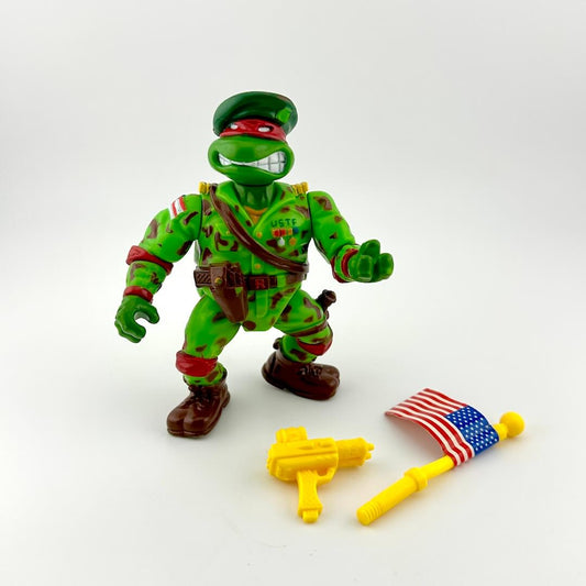 Toy figure in green camouflage with accessories on a white background