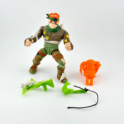 TMNT action figure with accessories on white background. 