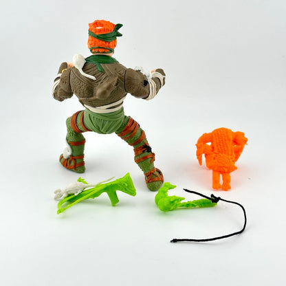 TMNT action figure with accessories on white background. 