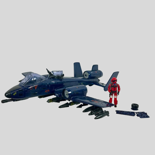 Toy blue jet with a red figure on a white background