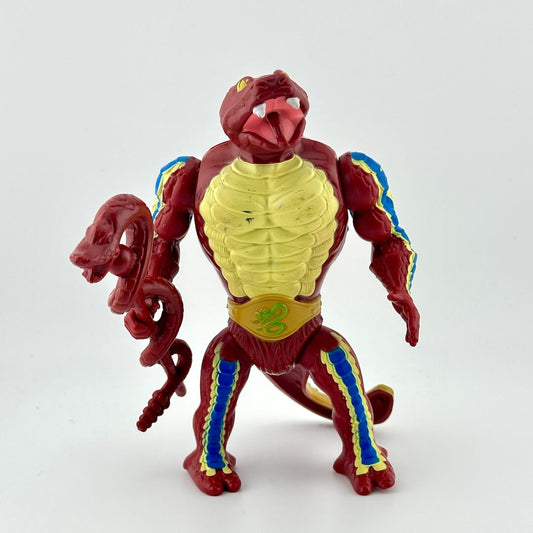 Snake-man action figure with staff against white background.