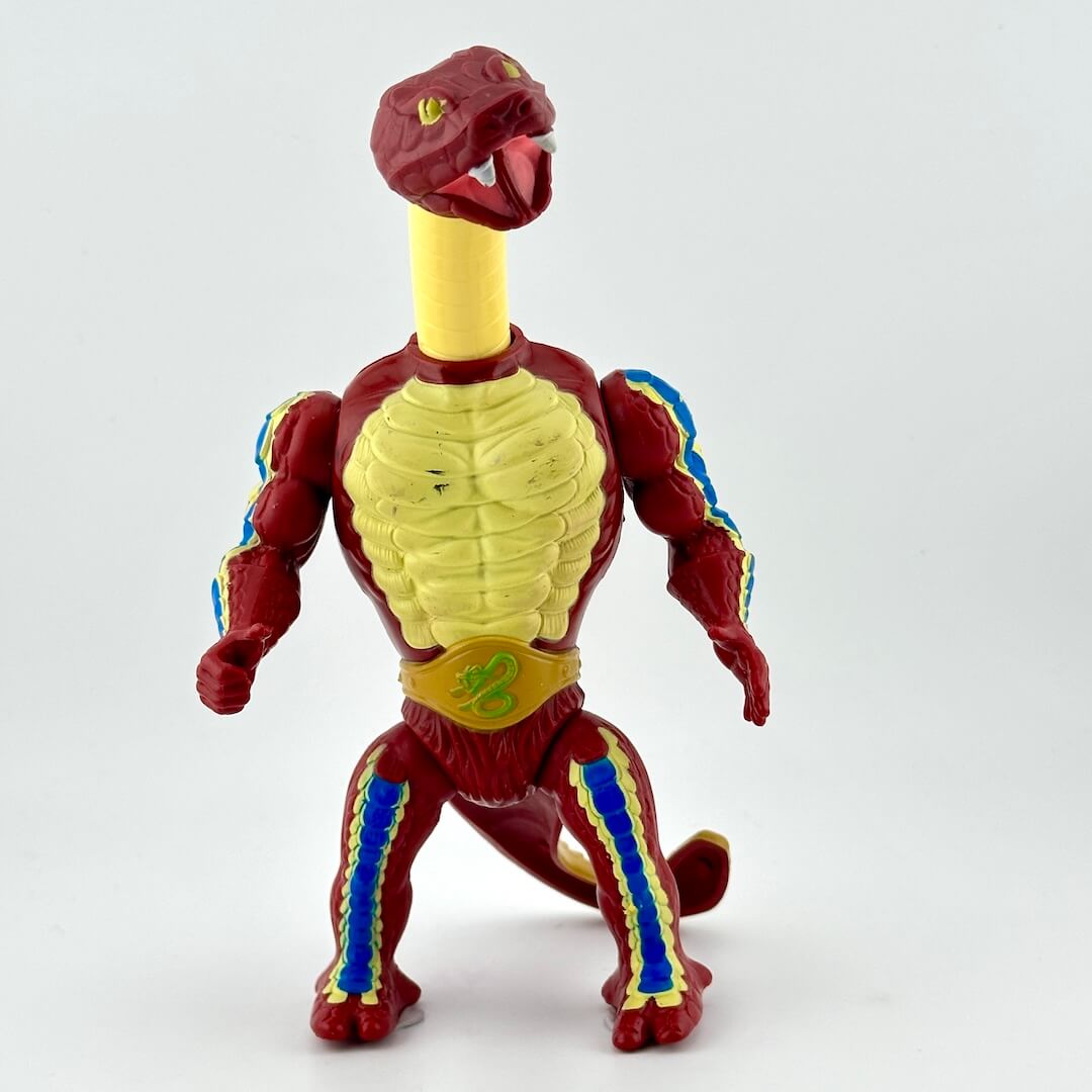 Snake-man action figure with neck extended against white background.
