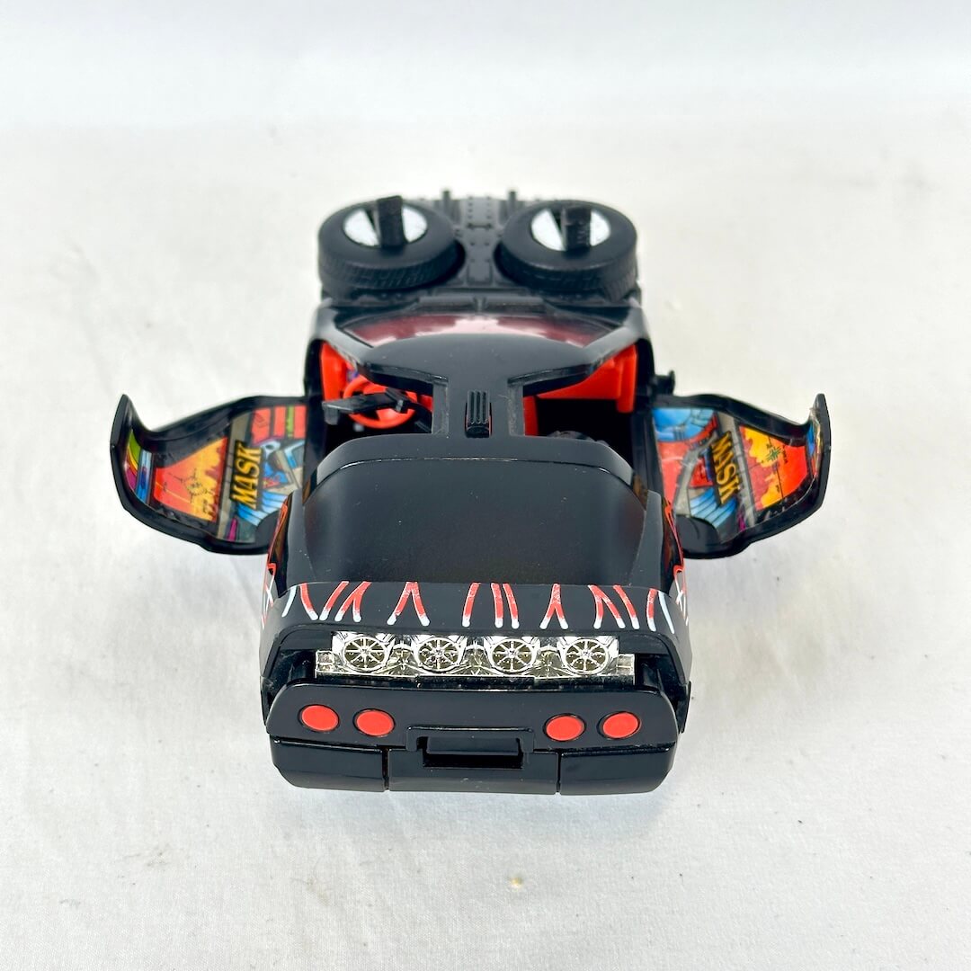 Black toy vehicle with wing doors and silver accents. 