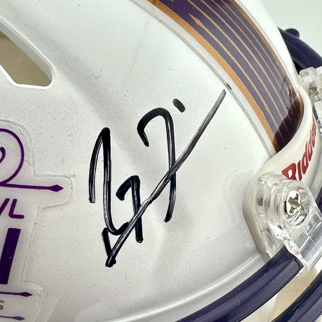 Close-up of signature on mini helmet. 