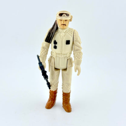 Action figure in desert gear with a rifle on a white background