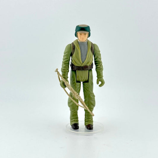 Action figure in green military uniform with a rifle on a white background