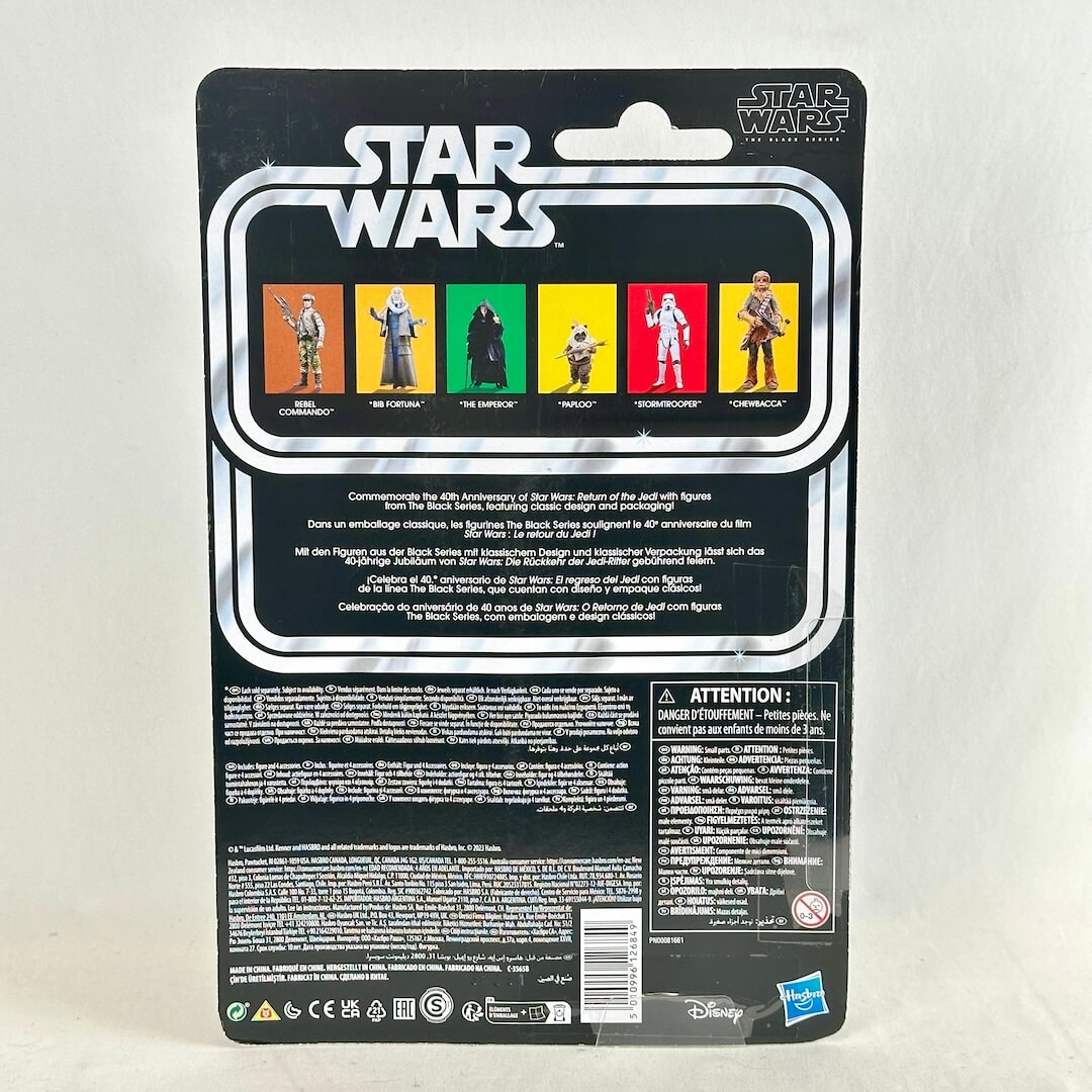 Back of a Star Wars action figure blister card package, showing the printed character lineup, & product description.
