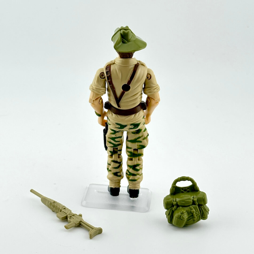 Toy soldier figure with accessories on a white background