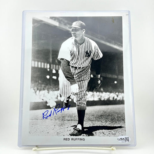 Black and white photo of a baseball player in uniform with 'Red Ruffing' signature on a white background
