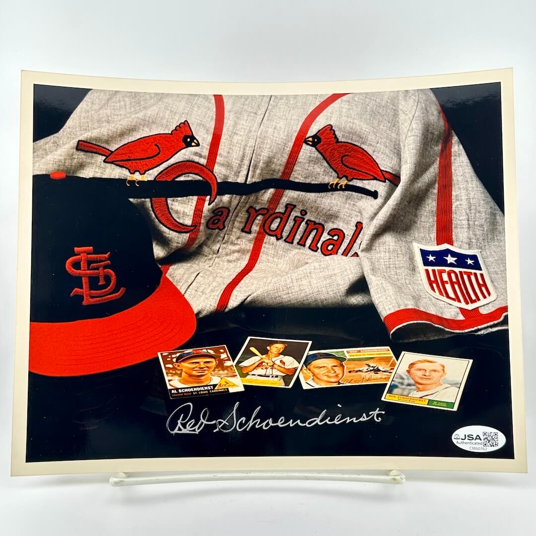 Framed St. Louis Cardinals memorabilia  photo with a jersey, cap, and cards. 