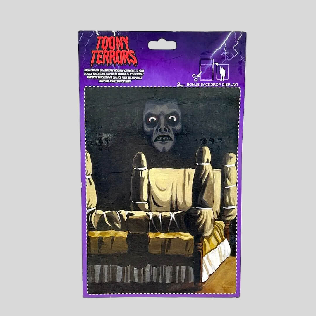 Packaged toy with a ghostly figure on a white background