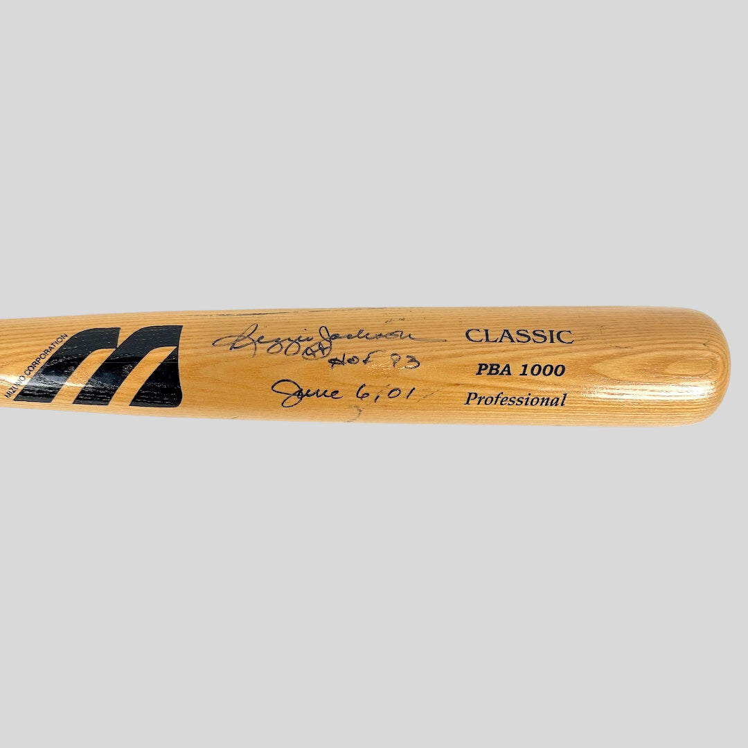 Wooden baseball bat with branding and text on a white background