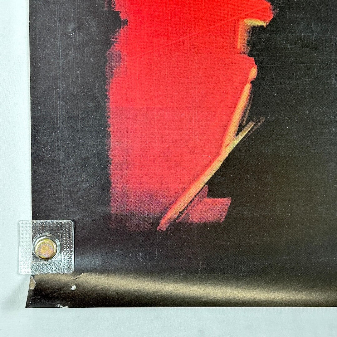 Bottom left corner with pin holes and some wear.