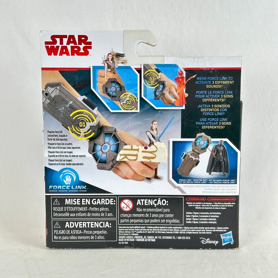 Star Wars toy blister pack, showing the back of the packaging with product photos, instructions, and warning labels. 