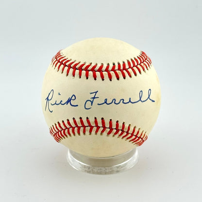 Baseball with red stitching and a signature on a white background