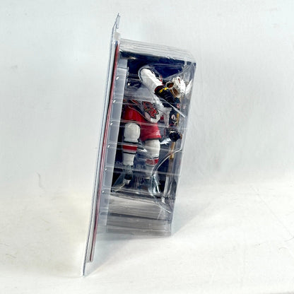 Hockey player action figure in clear packaging on a white background
